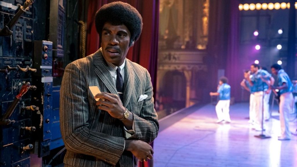 Colman Domingo as Joe Jackson, seen at the side of a stage while the Jackson 5 perform, in the musical biopic Michael