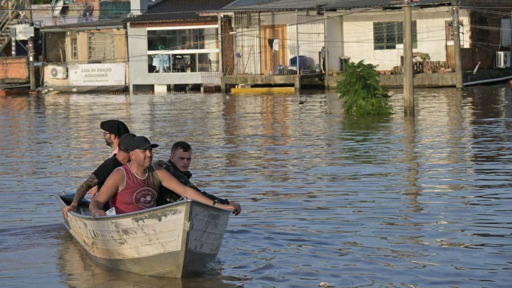 Rescuers use a boat to look for people at the Humaita neighbourhood in Porto Alegre, Rio Grande do Sul state, Brazil, on May 7, 2024.