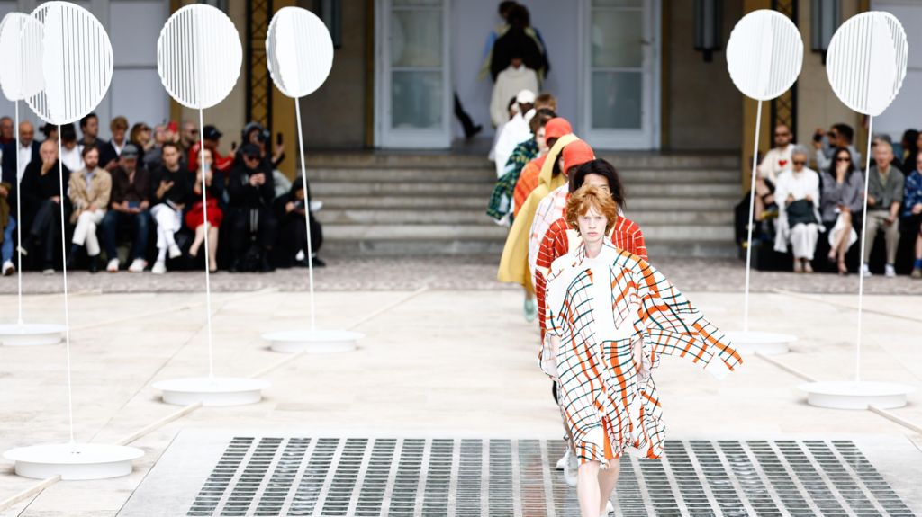 Models walk the runway at Issey Miyake