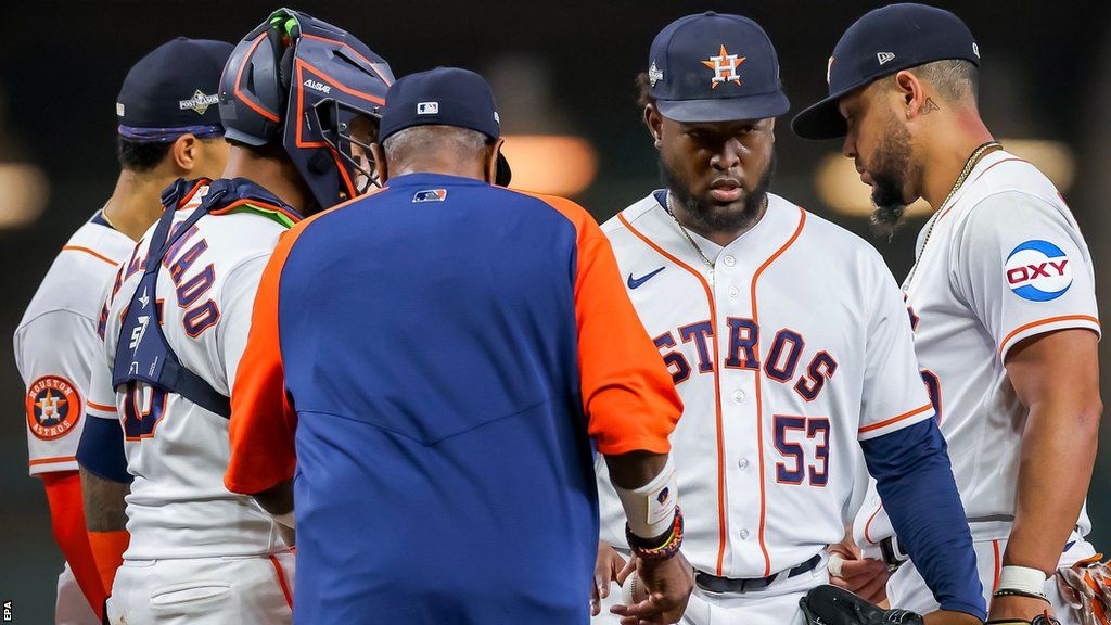 Houston Astros manager Dusty Baker takes starting pitcher Cristian Javier out of the game in the first inning