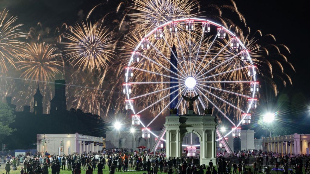 People watch a fireworks display that is attempting the largest firework display in history with 850,000 fireworks