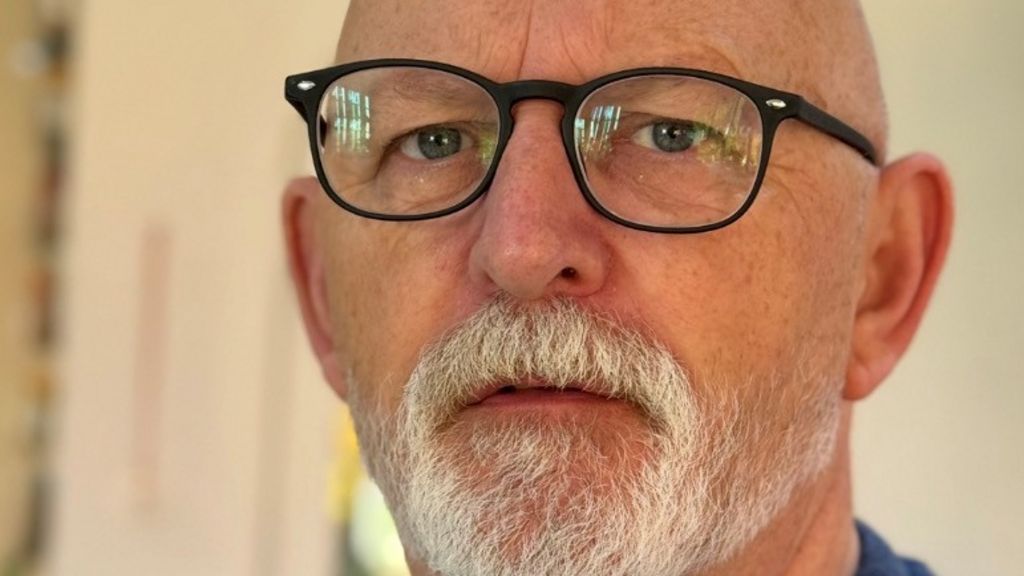 A selfie of a man with a white beard and glasses