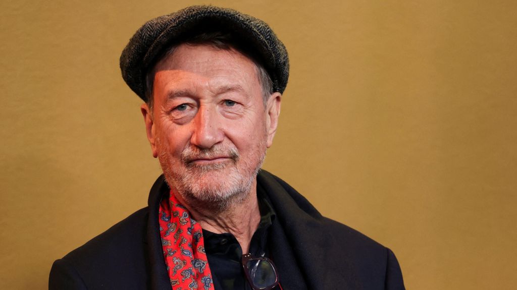 Steven Knight in a Peaky Blinders-style flat cap at the premiere of Peaky Blinders: The Immortal Man on 2 March 2026