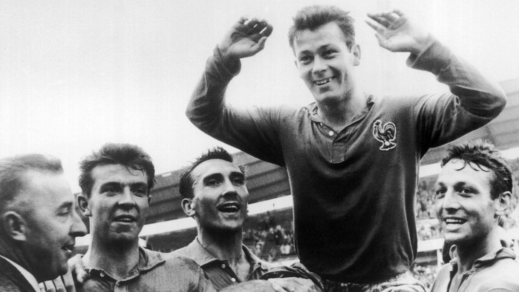 Just Fontaine being held aloft by his team-mates after finishing as top scorer at the 1958 World Cup