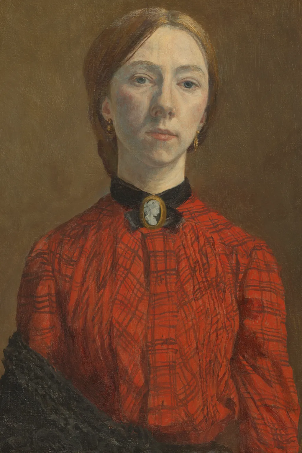 Oil painting of Gwen John. She is a white woman in her twenties. She has light red-brown hair pulled back into a low knot or bun at the back of her head. She is wearing an orange-red blouse with a check pattern on it. at her throat she is wearing a cameo broach with a black ribbon or collar around her throat. The clothing is consistent with the early 1900s. A black shawl is draped over her lower right arm.
