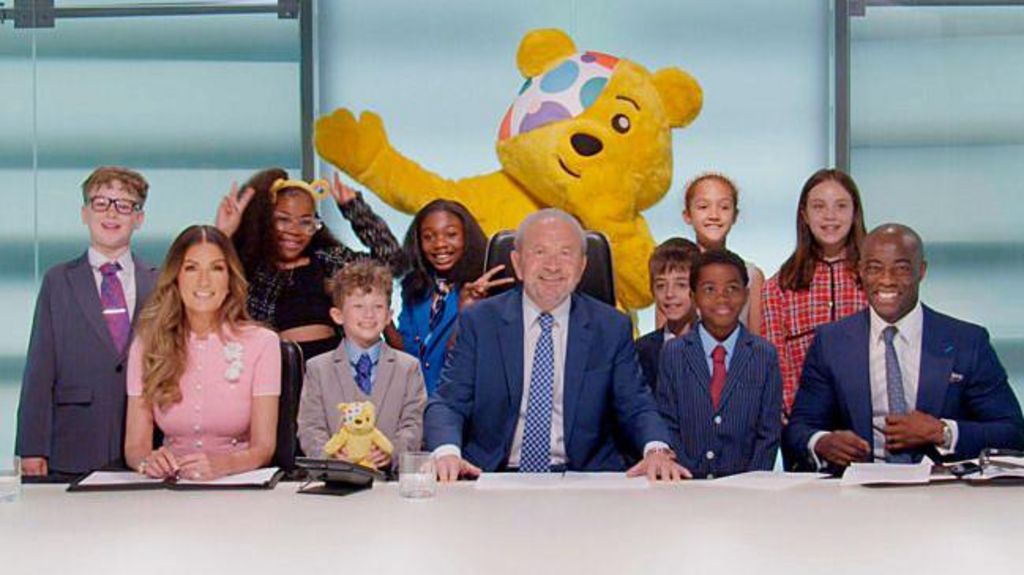 Mini apprentices plus L-R Baroness Karren Brady, Lord Sugar, Pudsey, Tim Campbell