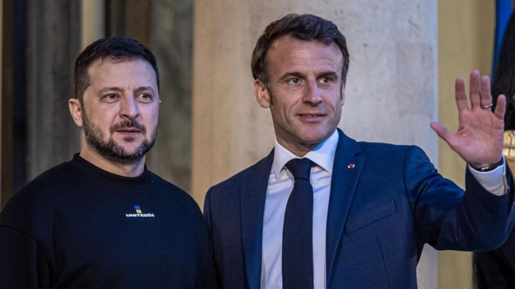 Volodymyr Zelensky and Emmanuel Macron pose for photographers