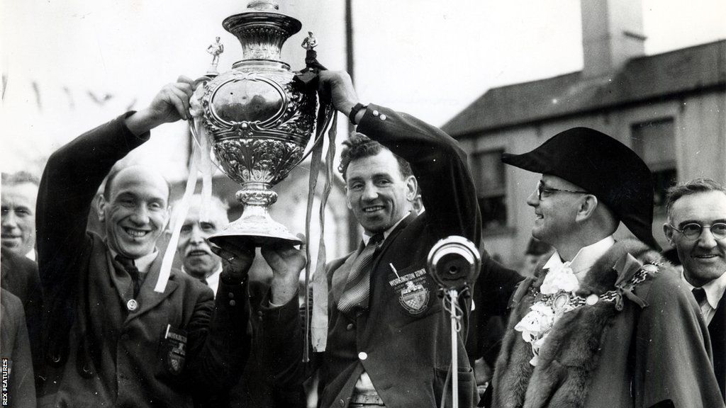 Billy Iveson and Gus Risman hold trophy