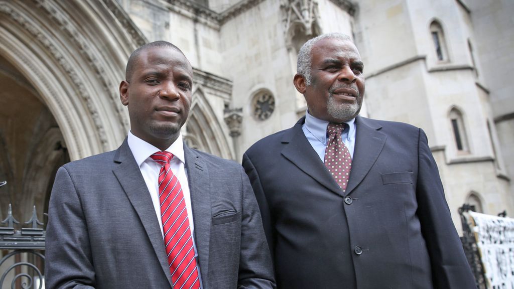 Duwayne Brooks (L) with Stephen Lawrence's father Neville outside the High Court in London in 2015