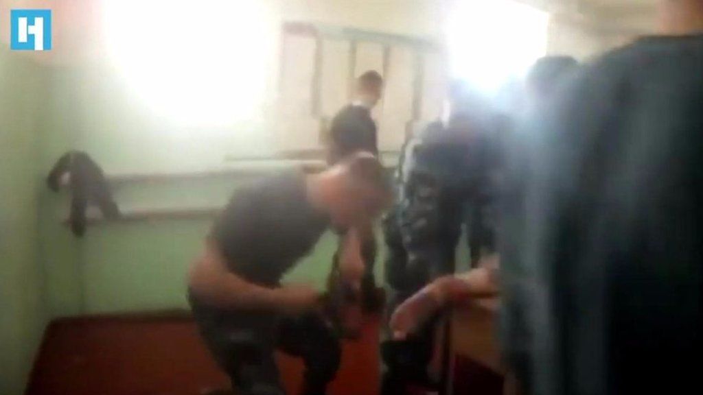 Prison guard beats man's feet
