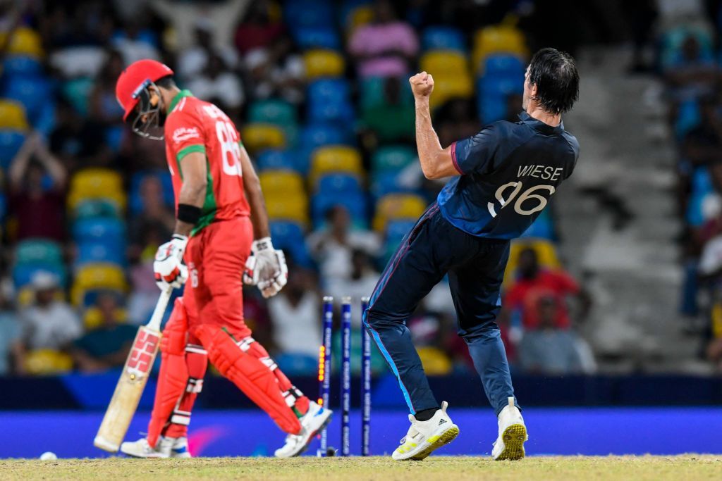 David Wiese celebrating after taking the wicket of Oman's Naseem Khushi