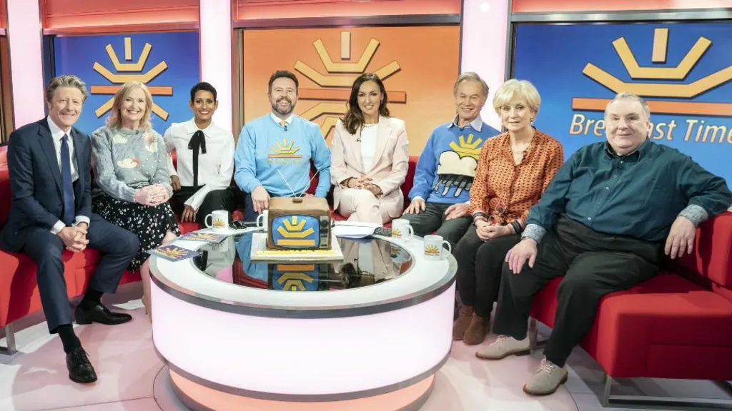 (left to right) Charlie Stayt, Carol Kirkwood, Naga Munchetty, Jon Kay, Sally Nugent, Francis Wilson, Debbie Rix and Russell Grant with a commemorative cake, on the red sofa as BBC Breakfast celebrate its 40th anniversary with a special show and guests at MediaCityUK, Salford. Picture date: Tuesday January 17, 2023.