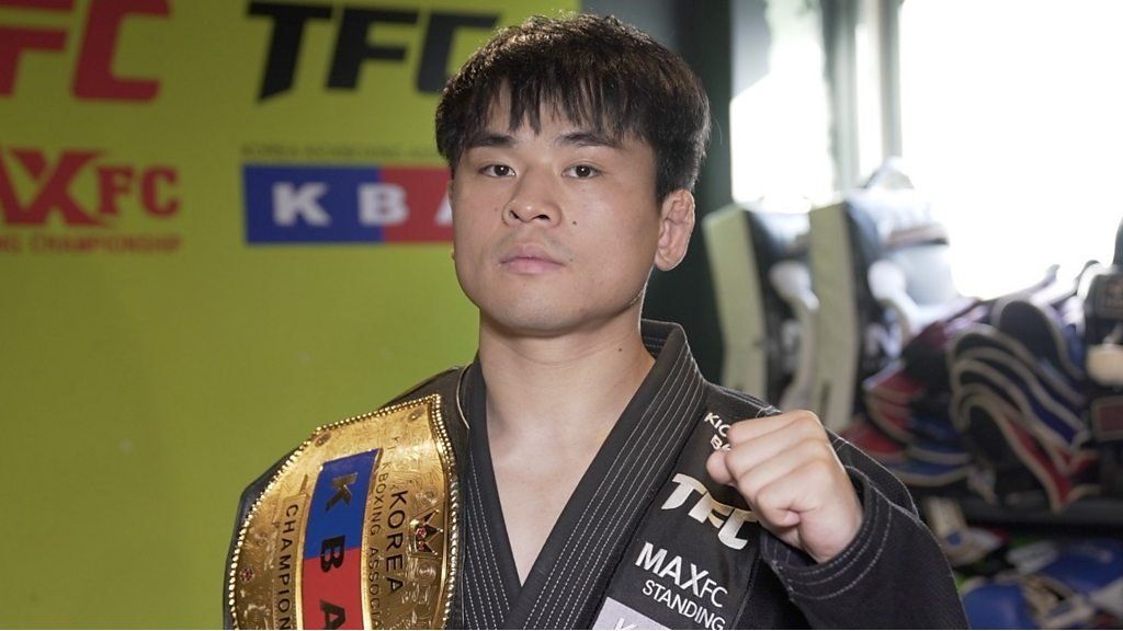 Jang Jung Hyuck poses with championship belt