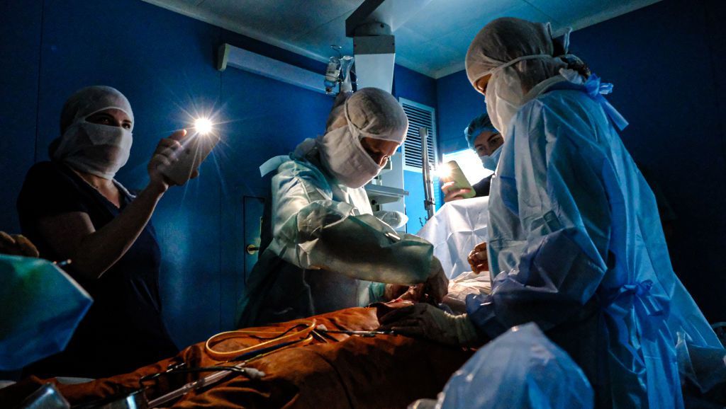 Doctors use phone lights to do surgery in Ukraine, November 2022