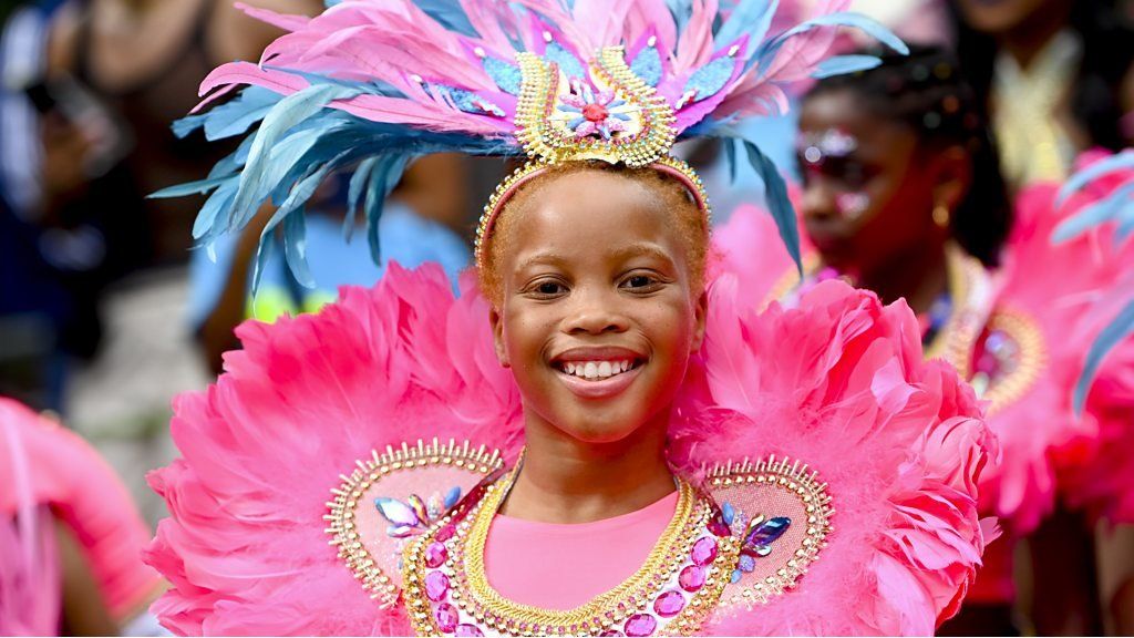 Young girl in colourful costume at Notting Hill Carnival