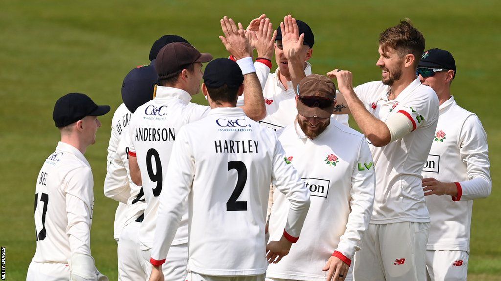 Lancashire players celebrate a wicket