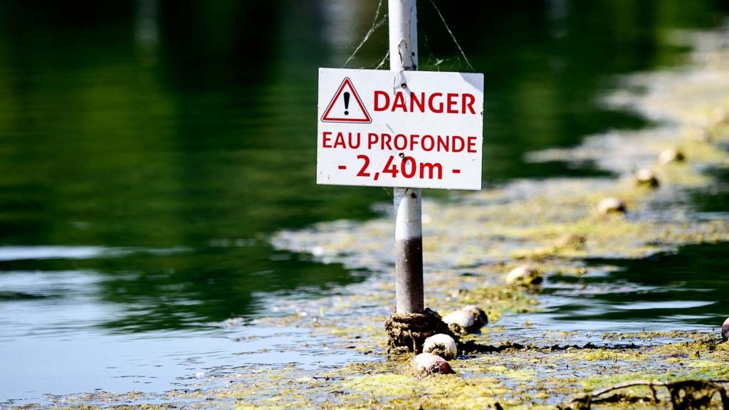 A river in France with a danger sign