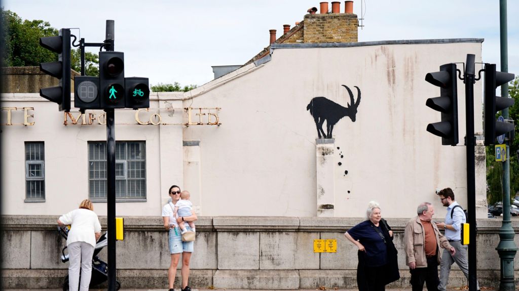 Banksy stencil of a goat on the side of a wall of a house in Kew, Richmond