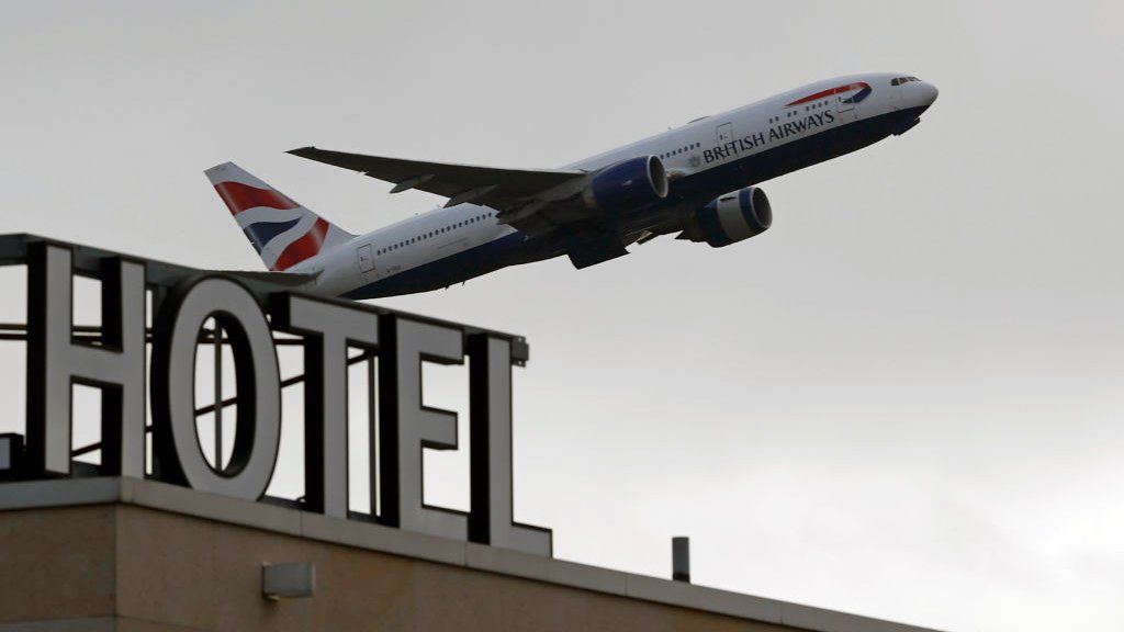 A British Airways aircraft is pictured as it takes off from behind the Sofitel hotel at Terminal 5 of London Heathrow Airport