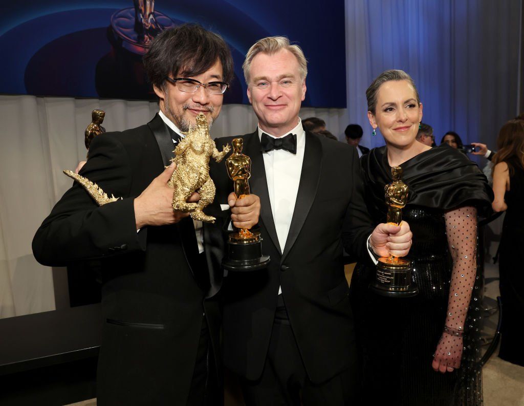 Takashi Yamazaki, posing with the award for Best Visual Effects for "Godzilla Minus One" Christopher Nolan with the award for Best Picture for "Oppenheimer" and Emma Thomas attend the Governors Ball during the 96th Annual Academy Awards at Dolby Theatre on March 10, 2024 in Hollywood, California