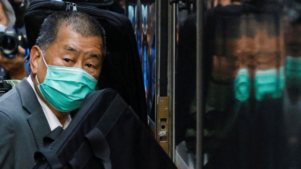 Jimmy Lai, founder of Apple Daily, looks on as he leaves the Court of Final Appeal by prison van, in Hong Kong in 2021