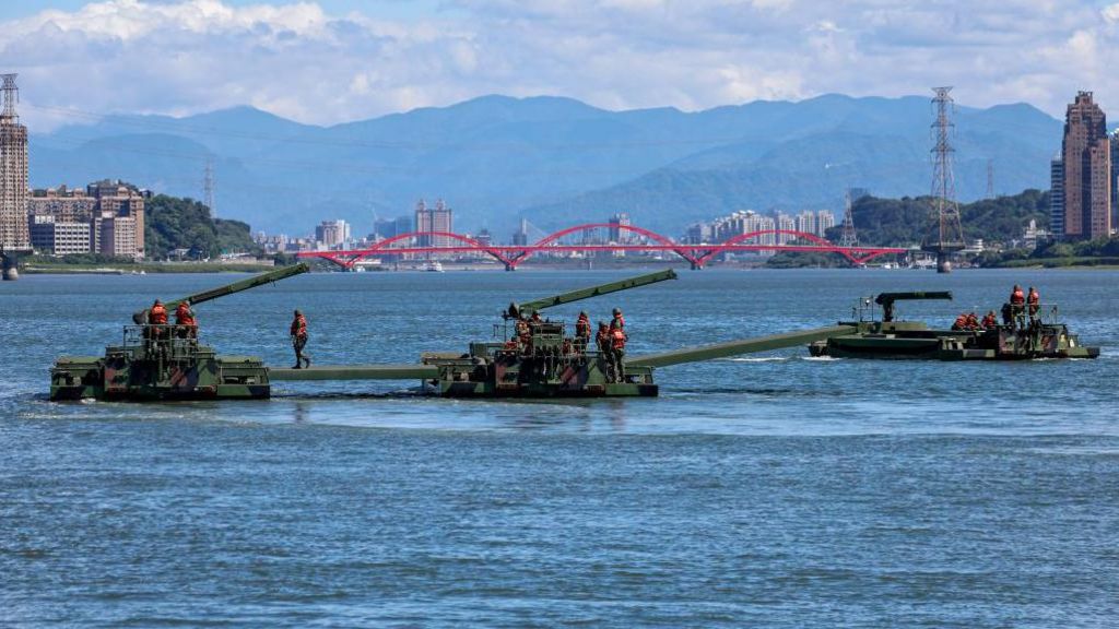 Soldiers on board an amphibious ferrying vehicle take part in a river defense exercise as part of the annual Han Kuang military drill, at Tamsui River in New Taipei, Taiwan on July 22, 2024