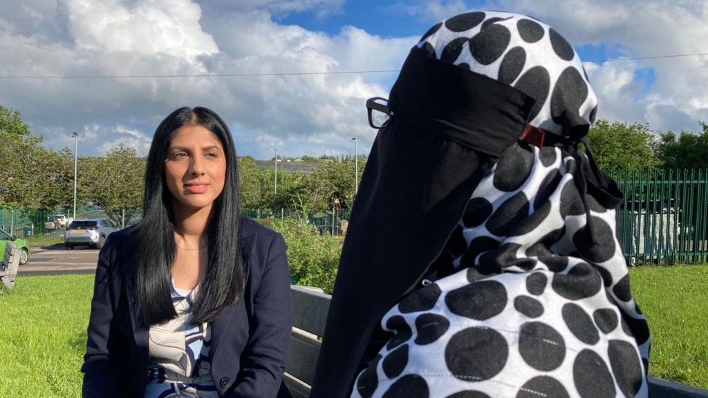 MWIP's founder Sofia Buncy talking to 'Neena' while sitting on a bench