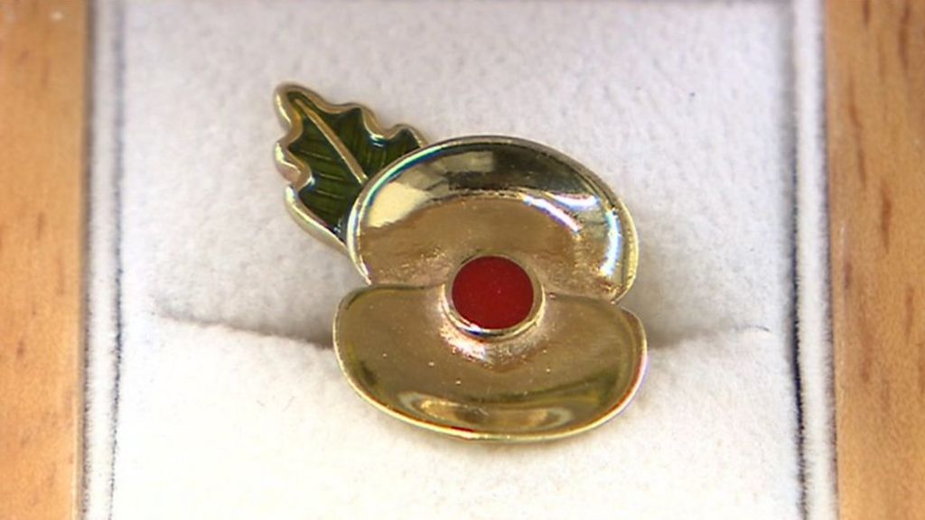 Poppy pins made from battlefield shells and mud
