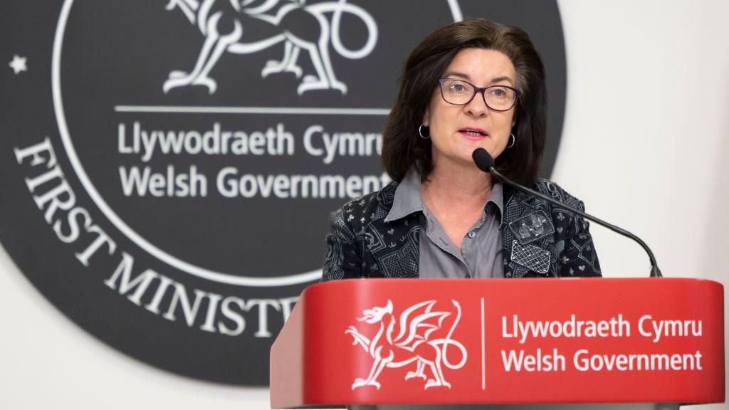 Eluned Morgan speaking at a Welsh government presser