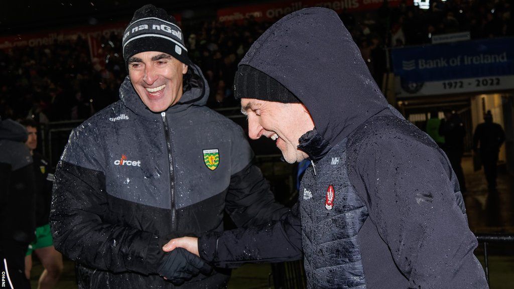 Jim McGuinness and Mickey Harte shake hands after Derry's victory over Donegal in the Dr McKenna Final in January