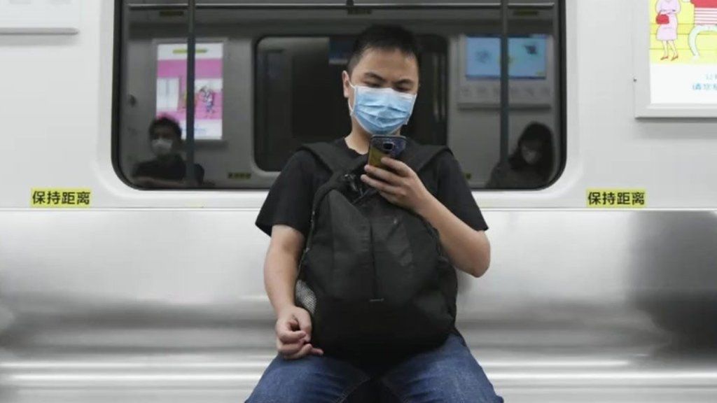 A man on a train in China.