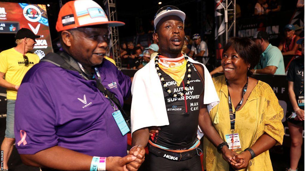 Sam Holness with dad Tony and mum Marilyn