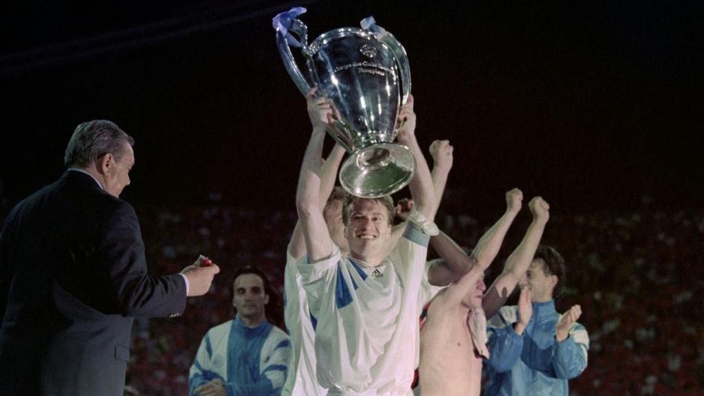 Didier Deschamps lifts the Champions League trophy with Marseille in 1993