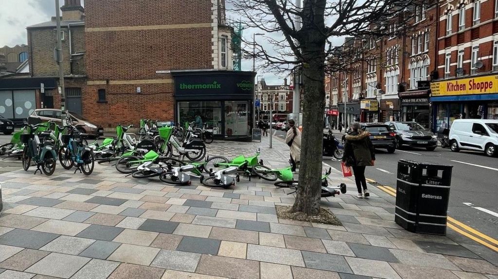 Image from April 2024 showing over a dozen bikes blocking a street crossing in Clapham Junction