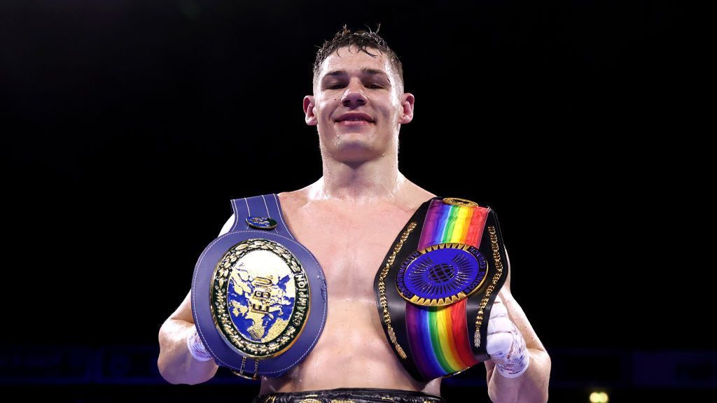 British boxer Chris Billam-Smith holding 2 belts