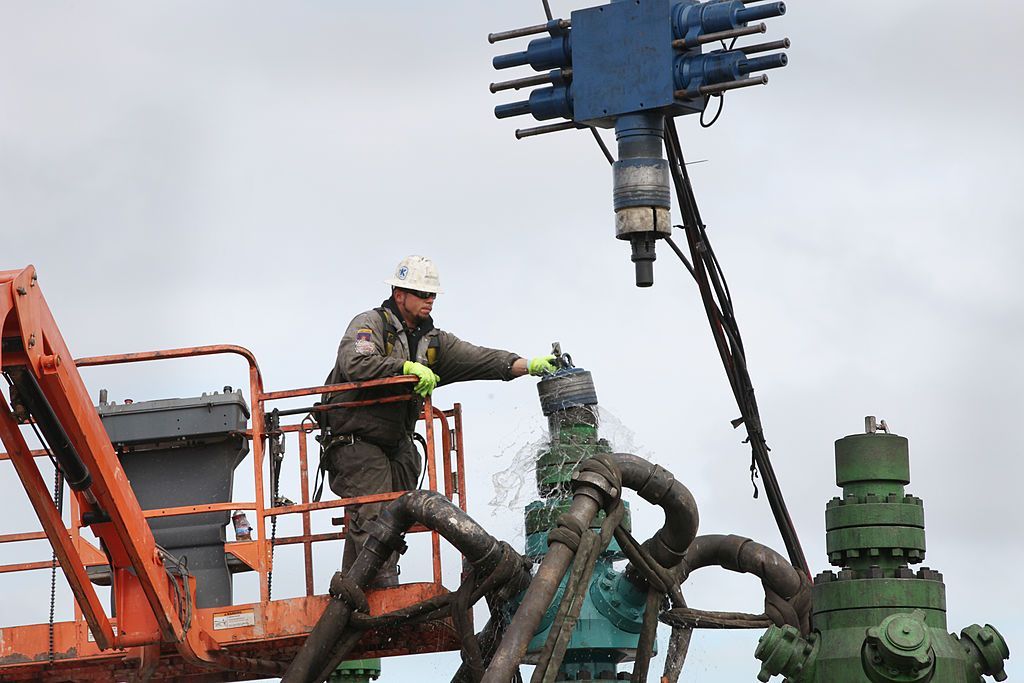 A worker in Pennsylvania cleans a fracking machine.