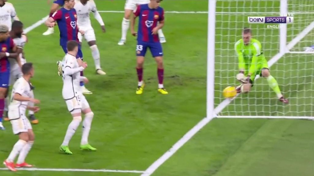 Screen grab of Lamine Yamal's effort with the Real Madrid goalkeeper Andriy Lunin trying to stop it from going over the goalline