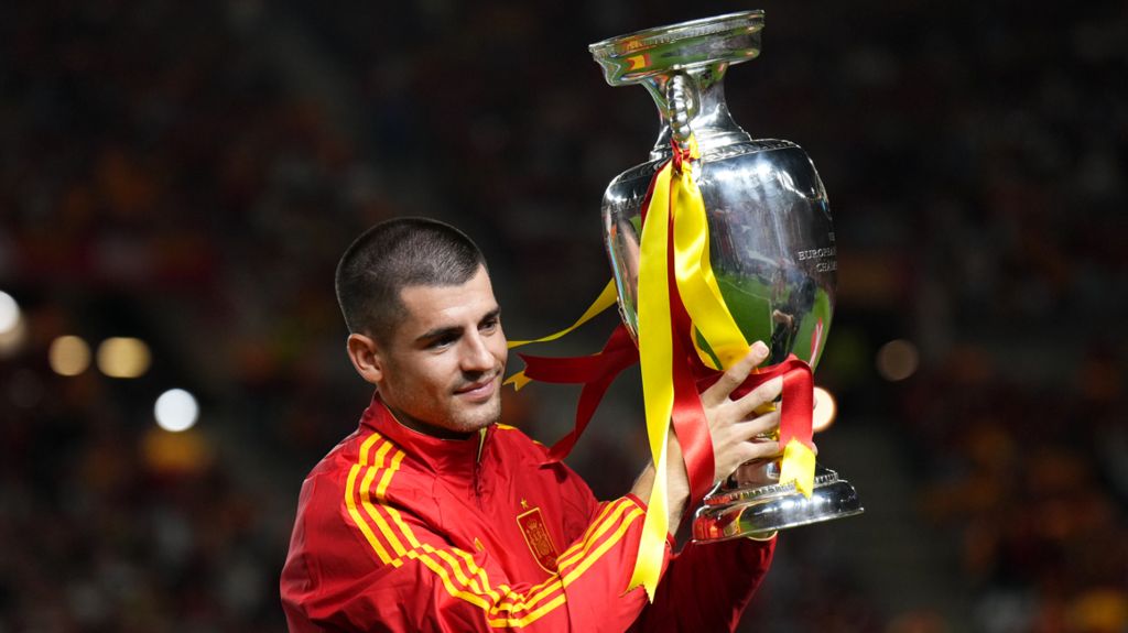 Spain captain Alvaro Morata shows off the European Championship trophy to fans before kick-off against Denmark in the Uefa Nations League