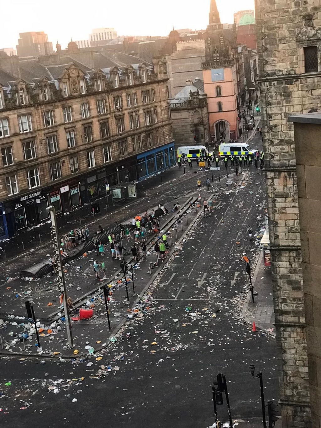 Birds eye view showing litter strewn streets as the sun rises at Glasgow Cross