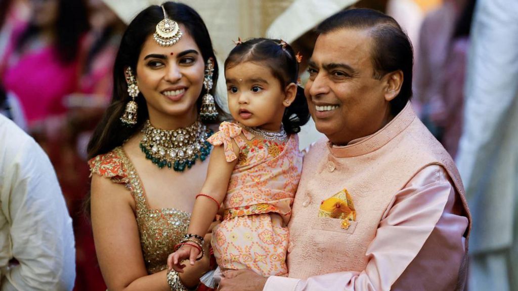 Mukesh Ambani poses for a picture with his daughter Isha Ambani and granddaughter Aadiya during the pre-wedding ceremony