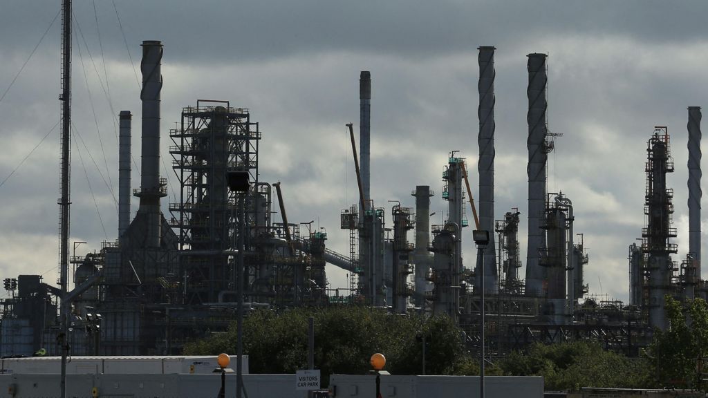 The Prax Lindsey Oil Refinery. A cluster of metal structures rising to the grey sky.