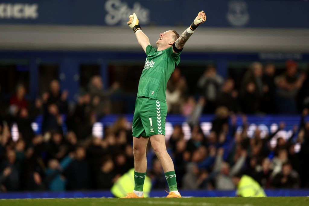 Jordan Pickford looks to the heavens and throws his arms into the air in celebration