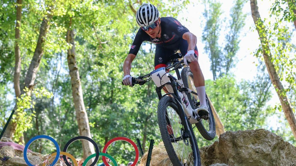 Tom Pidcock competes in the men's cross-country biking at the Paris 2024 Olympics.