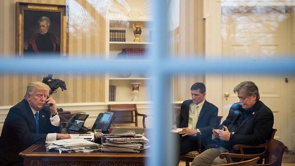 Steve Bannon seated across from then President Donald Trump and Gen Michael Flynn in the Oval Office in 2017.