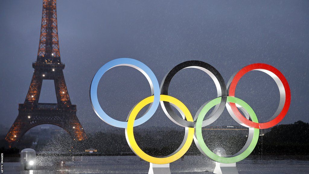 The Olympic rings with the Eiffel tower in the background