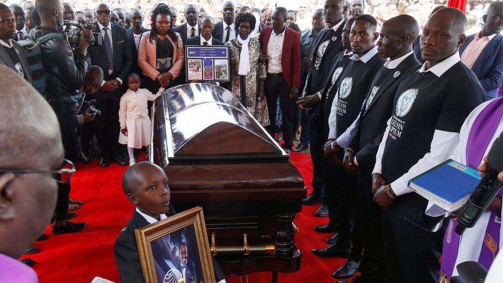 Family members surround the coffin of Kenya's marathon world record holder Kelvin Kiptum, who died in a road accident, during his funeral service in Chepkorio