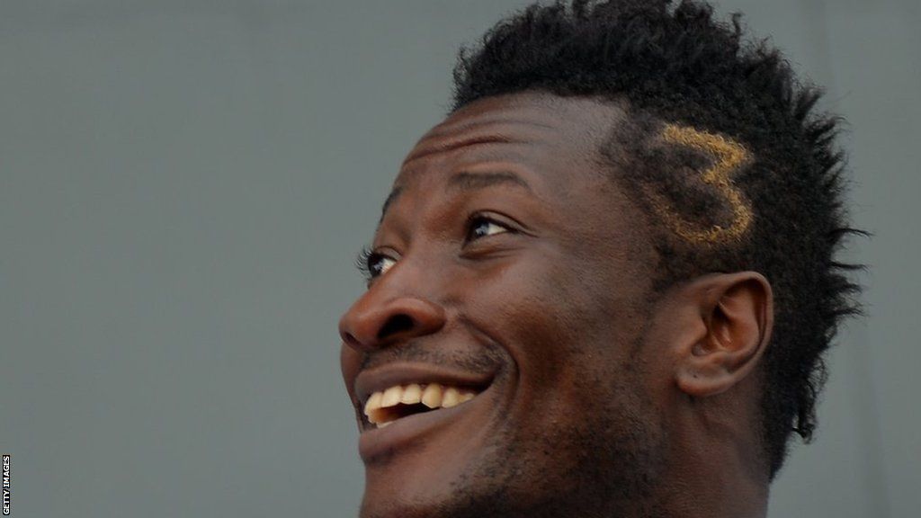 Asamoah Gyan with number three shaved into side of his head