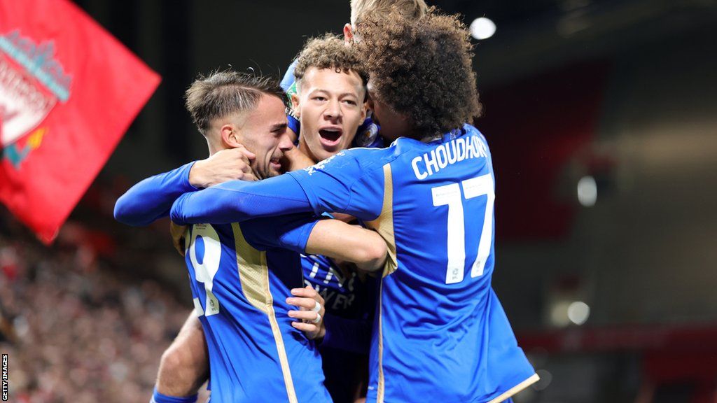 Kasey McAteer gets hugs from Leicester City team-mates after scoring the opener against Liverpool