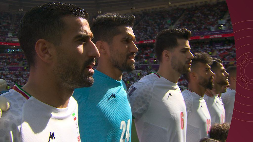 Iran team sing national anthem