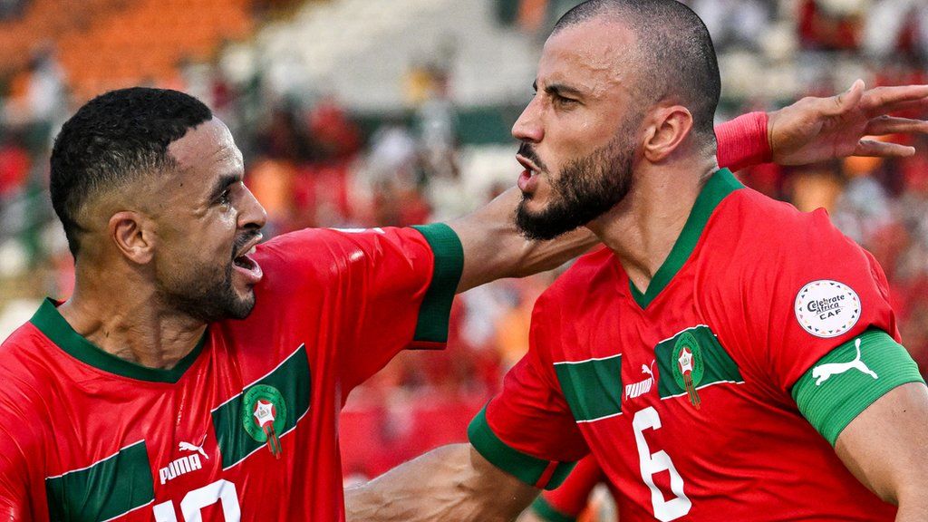 Morocco captain Romain Saiss (right) celebrates a goal against Tanzania
